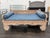 Design Plus Gallery presents a Vintage Hand-Carved Teak Daybed. The solid wood structure displays extensive hand-carved...
