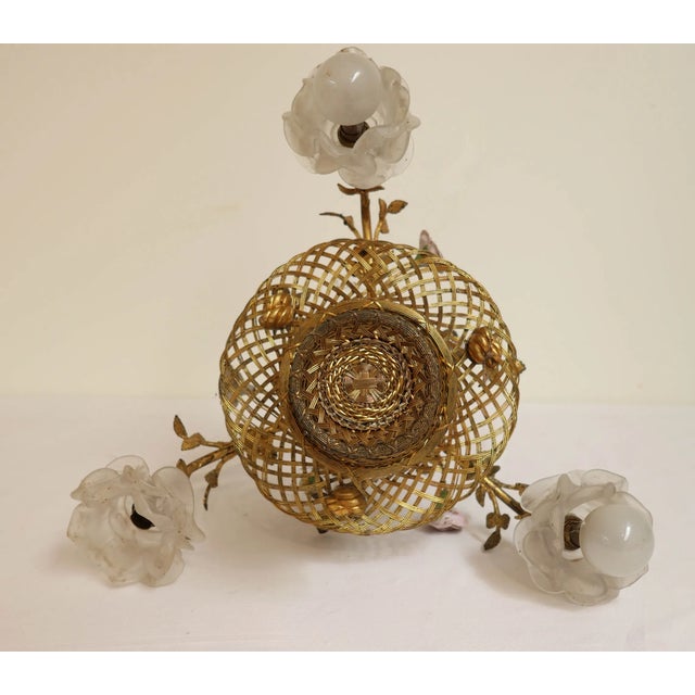 Four-Light Brass and Braided Brass Basket Pendant Light, in Very Good conditions. Designed before 1890 Up to 250V...