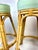 A stylish set of four vintage rattan bar stools by Cal-Asia Rattan Company, Los Angeles, retaining their original maker’s...