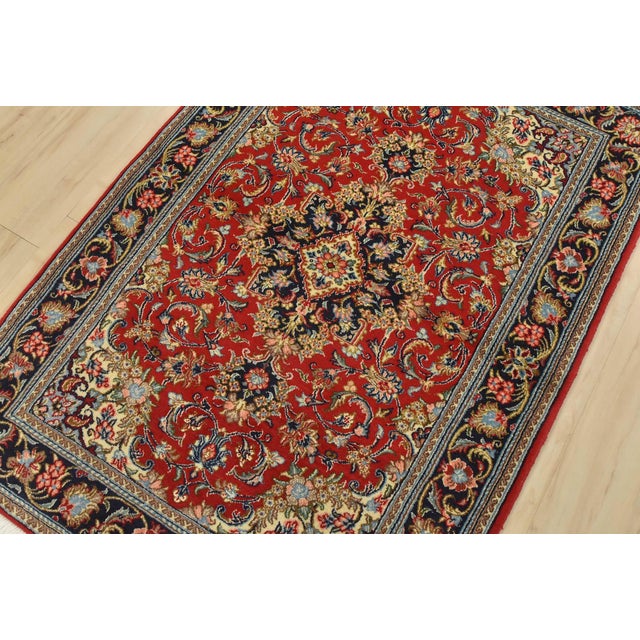 An authentic vintage traditional Qom rug, hand-knotted with fine wool and silk highlights, using natural dyes. This...