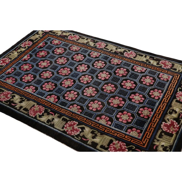 Hand-knotted in wool circa 1910-1920, this 4x6 antique Chinese rug is a remarkable signature piece from China. It features...