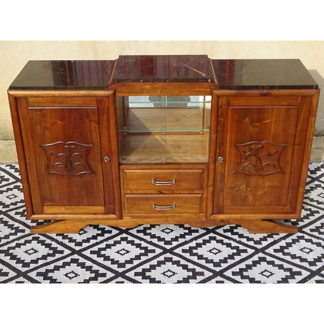 A beautiful art deco sideboard crafted entirely from solid walnut. Its clean, simple lines make it suitable for any décor....