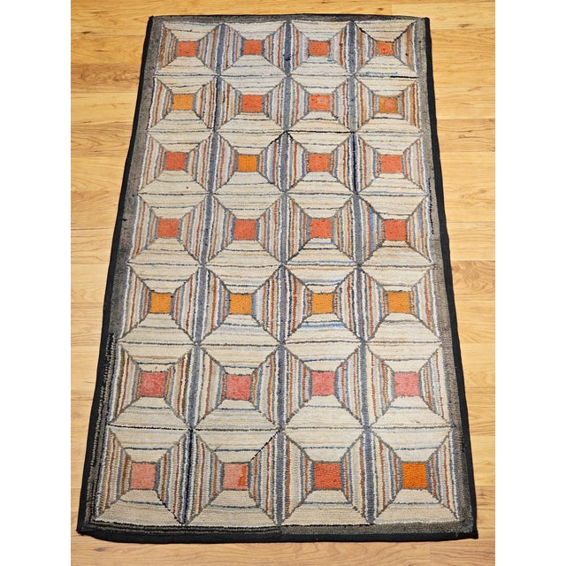 Celebrate the charm of American folk art with this exceptional vintage hand-hooked rug, crafted in the late 1800s in the...