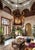 Make a dramatic architectural statement with this grand-scale 8-light wrought iron and parcel gilt lantern chandelier....