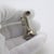 A vintage miniature depicting an antique telephone, handcrafted in silver in Italy between the 1970s and 1980s,...
