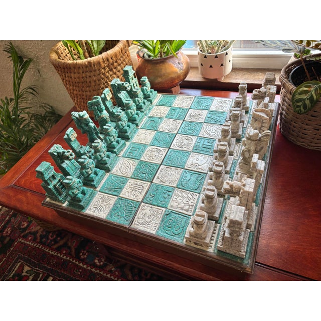 Vintage chess boxed set with fascinating Mayan Aztec pieces. We are unsure of what the pieces are made of, but seem to be...