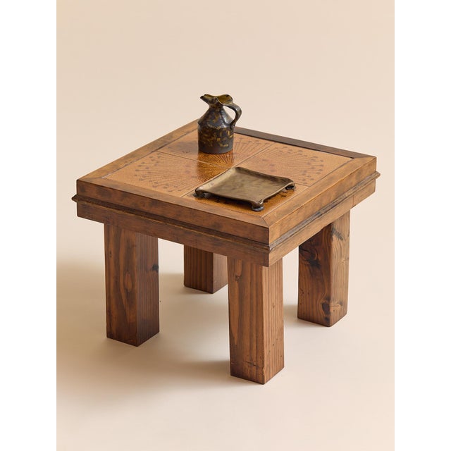 A beautifully grounded Danish side table featuring a four-tile inset top with a richly detailed radial sunburst motif. The...