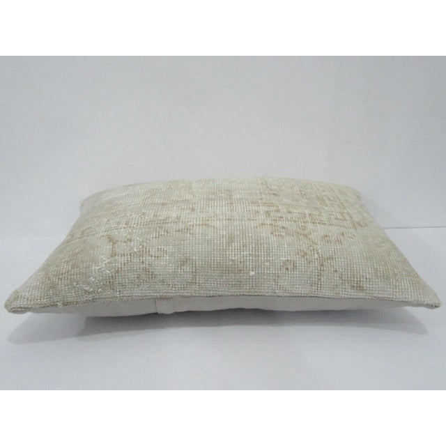 Decorative pillow cover made from a vintage Turkish handknotted rug. Backed with good quality cotton fabric. Pillow...