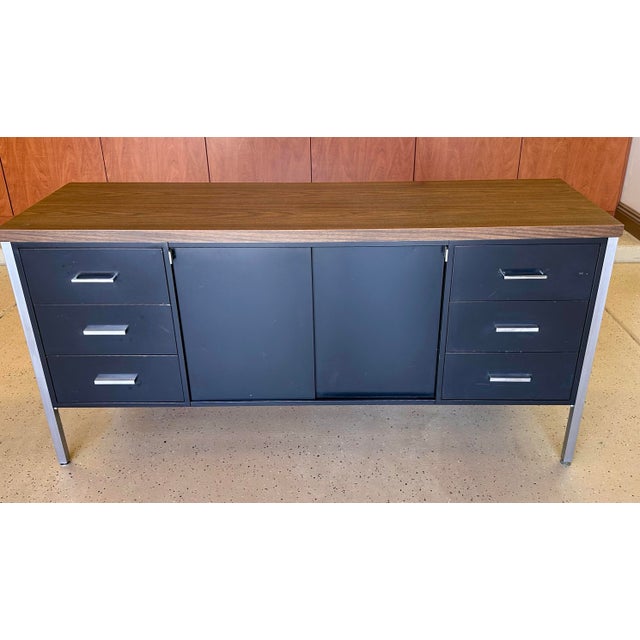 Vintage modern black steel / metal tanker credenza with chrome legs and laminate top. Six (6) side drawers with chrome...
