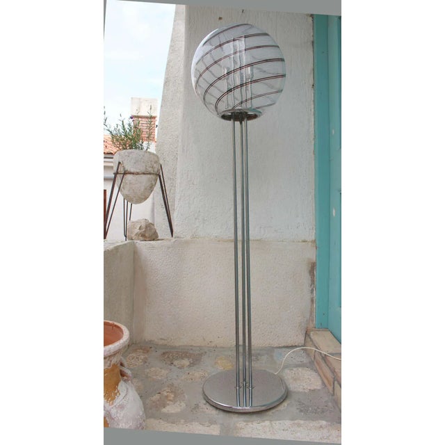 Italian floor lamp, chrome base and a large glass shade .Glass Shade is crack and we will sell it for $1300