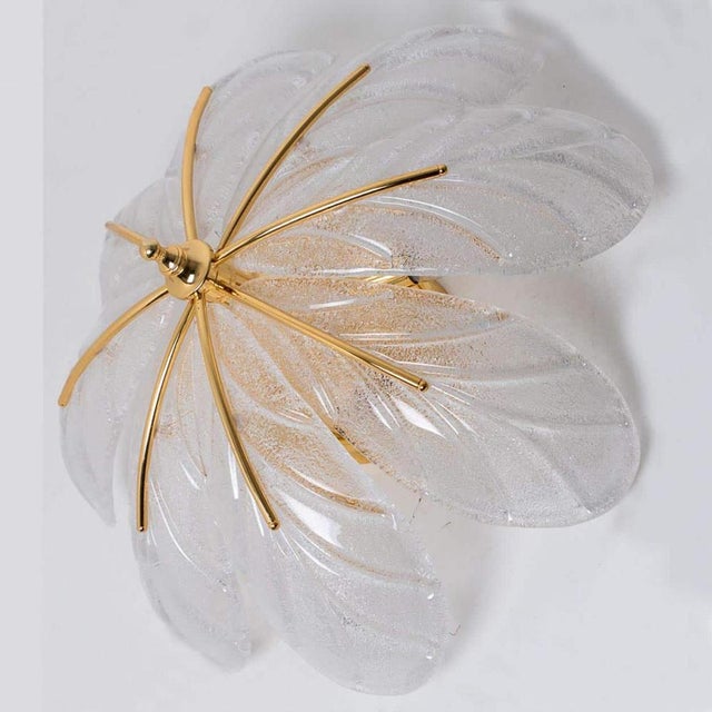 Beautiful and elegant hand-blown Murano glass chandelier. Made around the 1960s. This light fixture consists of eight...