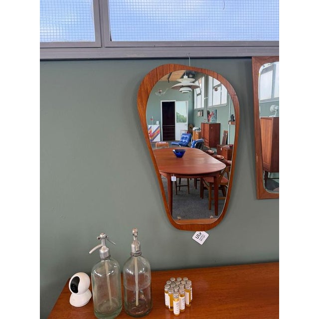 Organic shaped teak wood mirror in the 1960s, many scandinavian mirrors abandoned rigid geometries for freer, more natural...