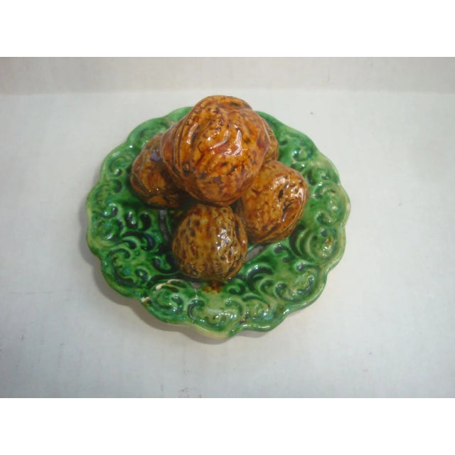 Wonderful small scale Portuguese antique majolica palissy plate stacked with 5 life-size walnuts. Marked Portugal signed...