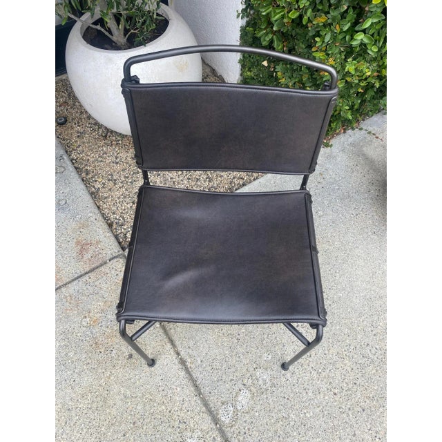 Stylish black metal frame chair with black leather seat and back. A great sturdy chair while not visually heavy. Would be...