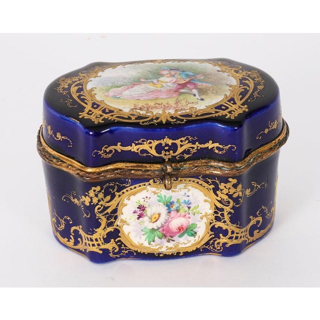 This is a fabulous petite antique French Sevres ormolu mounted cobalt blue soft paste porcelain casket, Circa 1870 in...