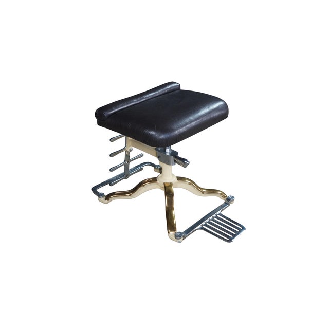 This rare and beautifully engineered vintage shoe store salesman fitting stool was manufactured by the historic McManis...