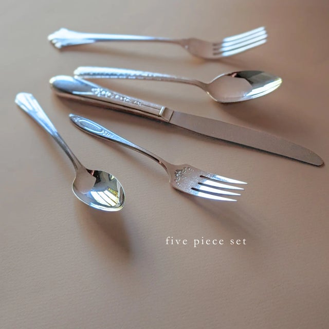 Mid Century silver plated flatware set with mis-matched patterns and styles. Each set includes five pieces: salad or...