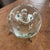 Clear glass round ball paper weight/decorative object with flat base. Very heavy and interesting. I have no knowledge of...