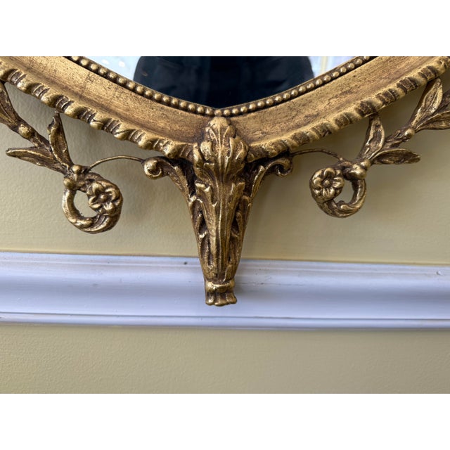 Giltwood Neoclassical Shield Wall Mirror With Urn Crest and Ornate Ribbon Swag For Sale - Image 4 of 6