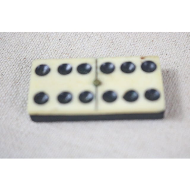 A set of late 19th century English dominos in their original box. This set is know as set of "sixies" in that the highest...