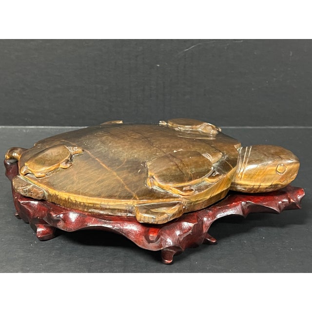 ITEM NAME: Chinese Art Carved Tuger Eye Stone Turtle Sculpture with Display Wooden Stand ORIGIN: China AGES: Late 20th...