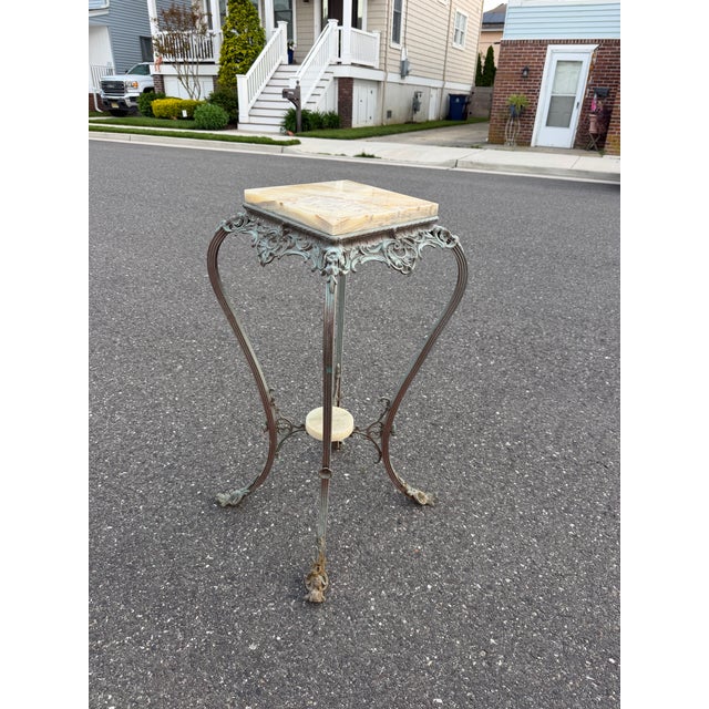 Victorian two tiered onyx plant stand with iron legs. H: 30.5” W: 15” Onyx Block: 10”x10”