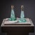 Pair of decorative small table lamps with bases in bluish-tinted glass. The twisted stem and round base with stylized...