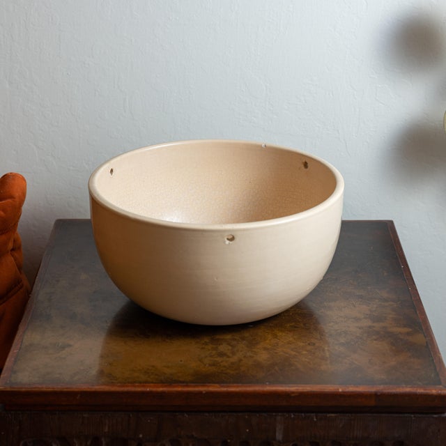 Dimensions: 12 7/8" D × 6 5/8" H Interior: 12" D Vintage Gainey Ceramics hanging planter featuring a simple hemispherical...