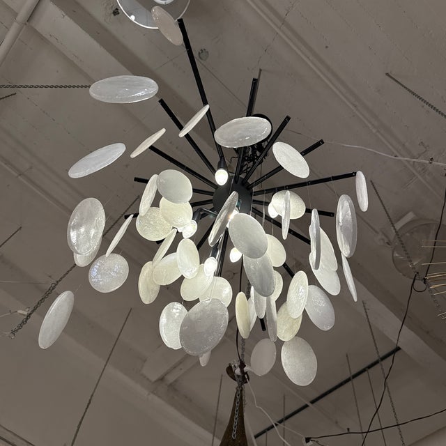 Design Plus Gallery presents the Tiffany Chandelier by Jay Jeffers for Arteriors. This chandelier has a shade of suspended...