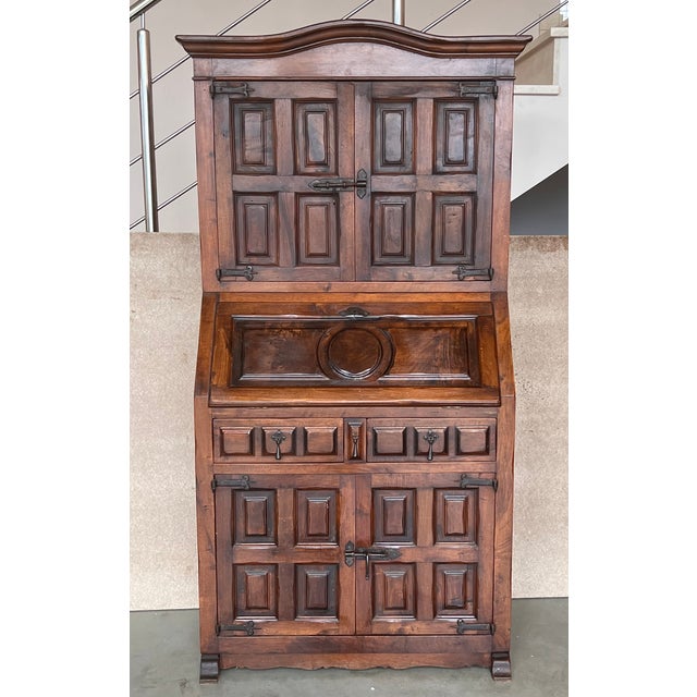 A late 19th century Spanish Walnut Bureau bookcase ‘secretaire’ with fretwork open swan neck pediment, centred by a shaped...