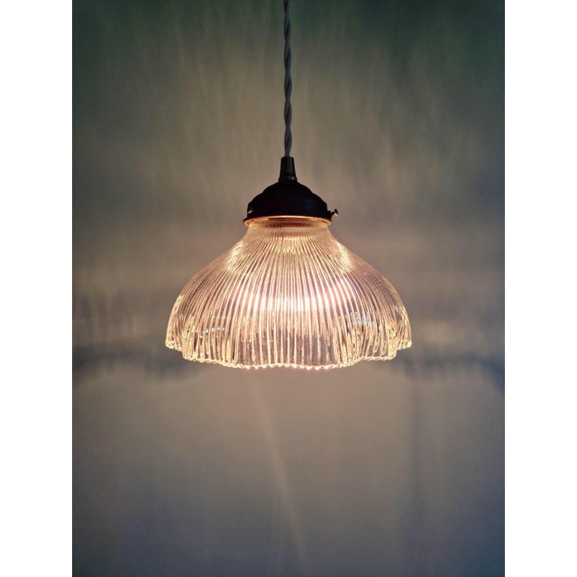 Holophane pendant light in clear, fluted glass, dating from the 1920s-30s. the pendant has been rewired and is compatible...