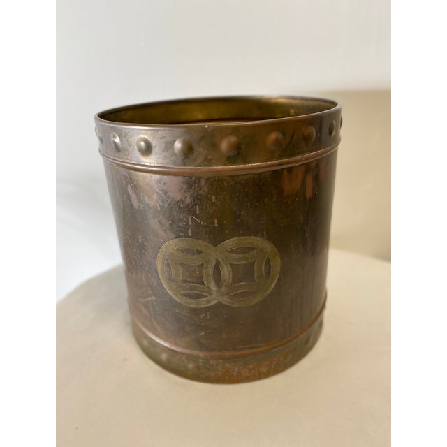 Mid Century Brass Cachepot with embossed decorative borders on top and bottom.