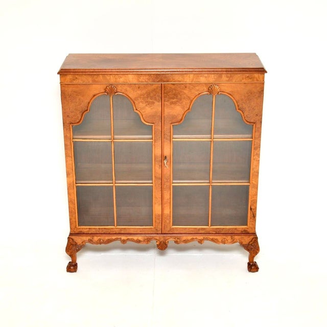 A beautiful and very well made antique burr walnut bookcase. This was made in England, it dates from around the 1920’s....