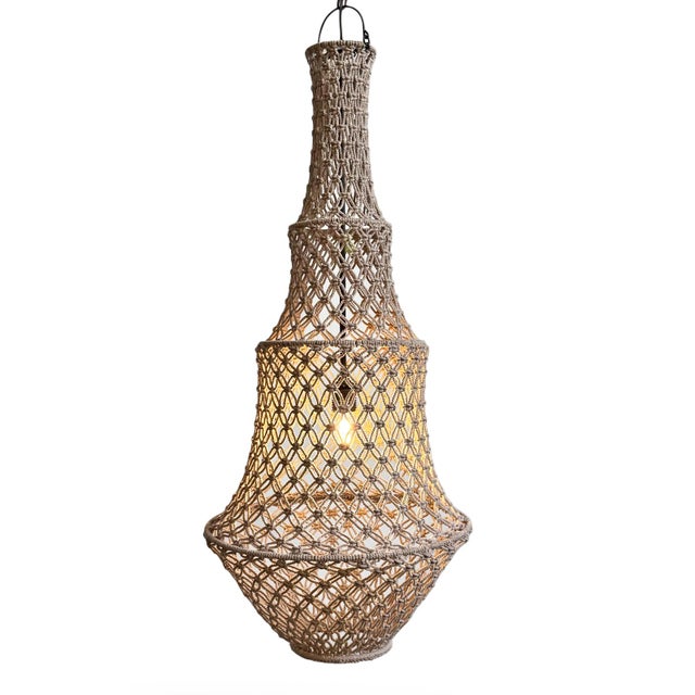 Impressive hand knotted macrame pendant light in a soft taupe color. Wonderful in groupings of different sizes or on its...