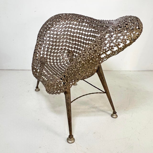 A rare Fauteuil à Corbeille or “Flower Basket” chair by the French sculptor Raymond Morales (1926-2004). The chair seat...
