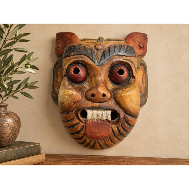 A distinctive vintage Thai folk-art wall mask featuring an exuberantly expressive stylized boar or swine character, hand-...
