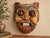 A distinctive vintage Thai folk-art wall mask featuring an exuberantly expressive stylized boar or swine character, hand-...