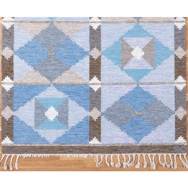 This charming Swedish flatweave exemplifies the clean geometry and understated elegance that have made Scandinavian...