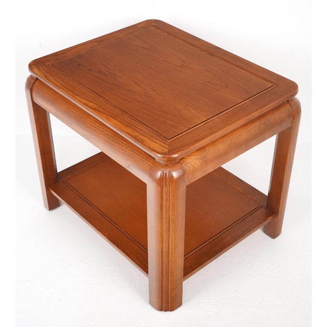 1970s Ming style side table made of a dark stained wood. Common features include rounded edges on the top, a simple lower...