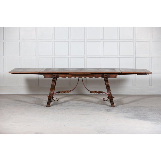 Circa 1940 spanish extending oak & iron dining table. Extended w 296 x d 100 x h 75cm not extended w 170 x d 100 x h 75cm.