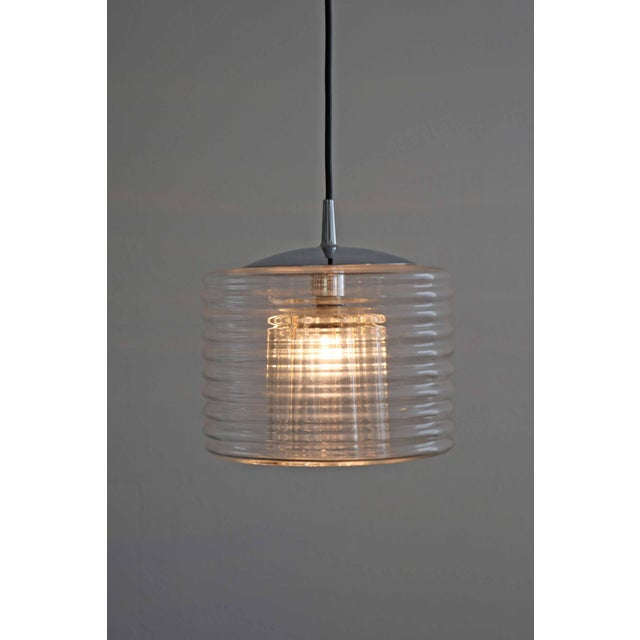 Peill & putzler "flower" pendant lamp by koch & lowy space age design from the 1970s stepped lampshade below, an 8-petaled...