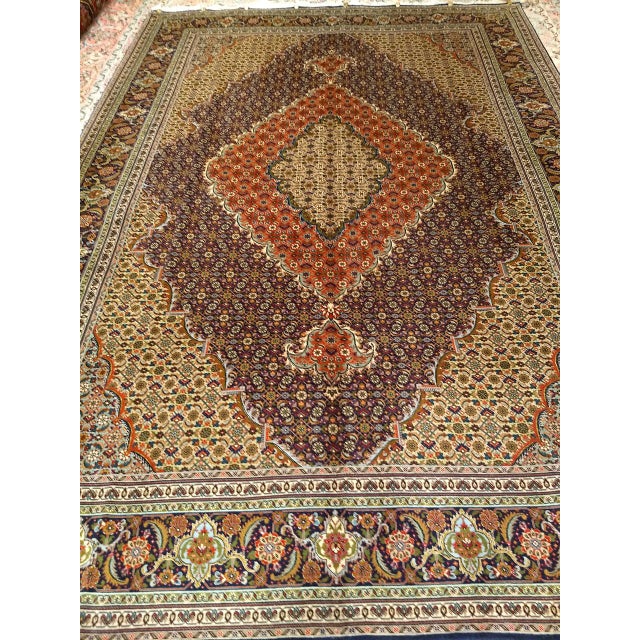 Beautiful early 20th Century Persian Tabriz Mahi room size rug hand-knotted during the first quarter of the 1900s. This...
