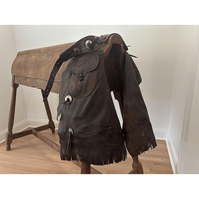 Here is a rare opportunity to own a piece of Colorado western history. This pair of short riding chaps were made by S.C....