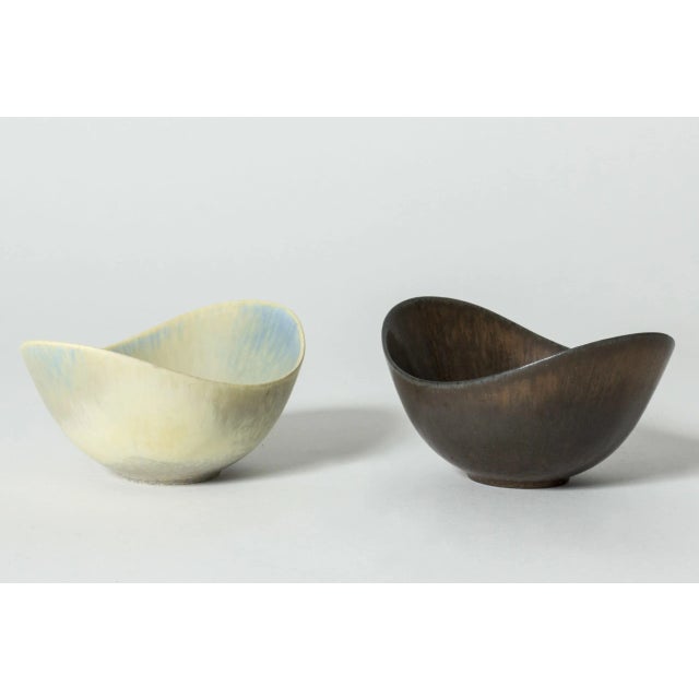 Pair of stoneware bowls by Gunnar Nylund, of the appealing “ARO” model. Streamlined, oval form with plunging sides. One...