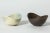 Pair of stoneware bowls by Gunnar Nylund, of the appealing “ARO” model. Streamlined, oval form with plunging sides. One...