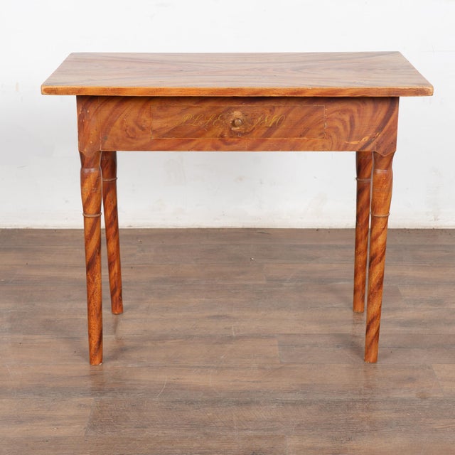 This delightful pine side table comes from the Swedish countryside and still maintains the original faux wood painted...