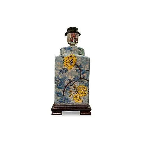 Asian blue and yellow floral vase lamp is delightful with the yellow flowers pattern. The contrast is sharp on a walnut...