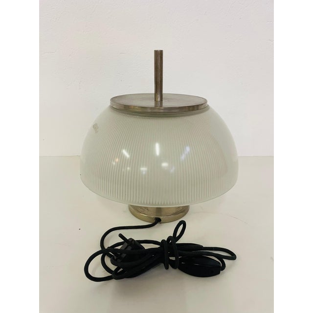 Alfetta table lamp by Sergio Mazza for Artemide. Made in 1966, nickel-plated brass with a textured glass shade. In very...