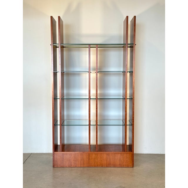 90s display unit in cherry veneered plywood, glass shelves, rests on 4 wheels which make it easy to move, finished on both...