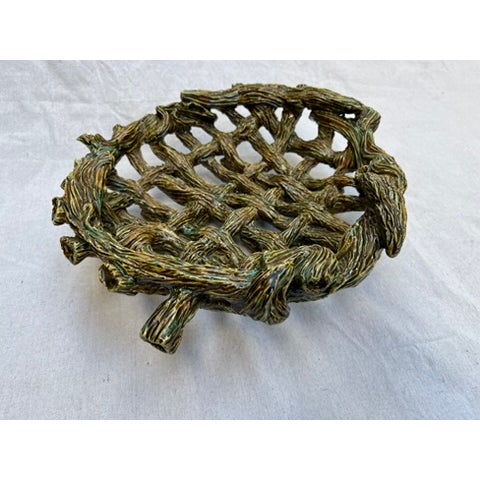 A single vintage pottery woven basket or bowl featuring a Palissy style glaze over a faux bois textured finish.